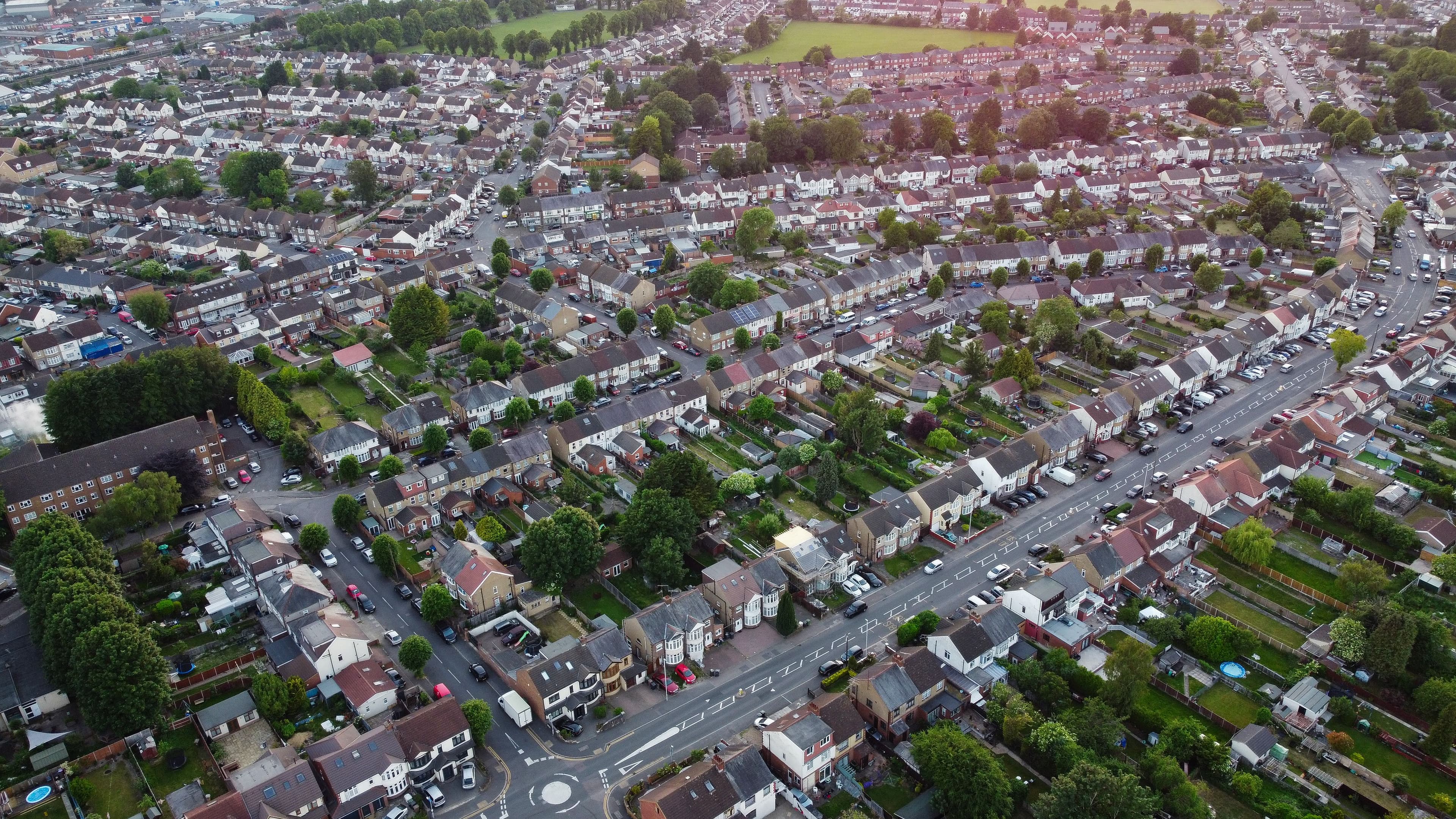Aerial view of terraced houses and gardens in a UK neighbourhood